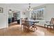 Inviting dining room with hardwood floors and large windows providing natural light at 135 Rapture Ln, Wando, SC 29492