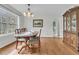 Classic dining room with hardwood floors, elegant chandelier, and traditional furnishings at 135 Rapture Ln, Wando, SC 29492