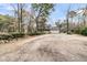Charming two-story home with a welcoming front porch, large yard, and two-car garage at 135 Rapture Ln, Wando, SC 29492