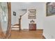 Welcoming foyer featuring hardwood floors, a staircase, and elegant decor, offering a warm first impression at 135 Rapture Ln, Wando, SC 29492
