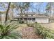 Traditional two-story home featuring a welcoming wrap-around porch and a convenient two-car garage at 135 Rapture Ln, Wando, SC 29492