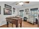 Recreation room with a foosball table, comfortable seating, and ample natural light at 135 Rapture Ln, Wando, SC 29492