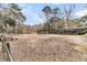 Horse property with an open shelter, lush greenery, and mature trees at 135 Rapture Ln, Wando, SC 29492