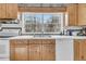 Kitchen featuring wood cabinets, white tile countertops, and a stainless steel sink at 135 Rapture Ln, Wando, SC 29492