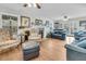 Spacious living room features a fireplace, hardwood floors, and comfortable seating arrangement at 135 Rapture Ln, Wando, SC 29492