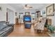 Bright living room with hardwood floors, ceiling fan, and a comfortable leather sofa at 135 Rapture Ln, Wando, SC 29492
