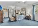 Spacious main bedroom featuring a four-poster bed, soft carpeting, and a ceiling fan at 135 Rapture Ln, Wando, SC 29492