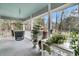 Inviting porch with swing and decorative table set, perfect for enjoying the outdoors, light blue paneled ceiling at 135 Rapture Ln, Wando, SC 29492