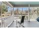 Enjoy views of a horse pasture from this comfy rocker, set on a beautiful wrap-around porch at 135 Rapture Ln, Wando, SC 29492