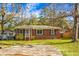 Charming brick home with a screened porch and ample yard space at 137 Dowling Ave, Walterboro, SC 29488