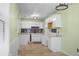 Charming kitchen with white cabinets, and black hardware, perfect for culinary enthusiasts at 137 Dowling Ave, Walterboro, SC 29488