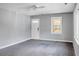 Bright living room featuring neutral paint, ceiling fan and natural light from multiple windows at 137 Dowling Ave, Walterboro, SC 29488