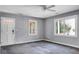 Cozy living room featuring neutral paint, large windows and a ceiling fan to keep you comfortable at 137 Dowling Ave, Walterboro, SC 29488