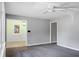 Inviting living room with neutral paint and ceiling fan, perfect for relaxing or entertaining guests at 137 Dowling Ave, Walterboro, SC 29488