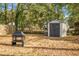 View of shed with a fire pit in the backyard at 137 Dowling Ave, Walterboro, SC 29488