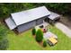 Aerial view of metal-sided building, machinery, and lush landscaping at 140 Old Plantation Ln, Moncks Corner, SC 29461