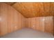 A smaller bedroom with carpet flooring, wood paneled walls, and a closet at 140 Old Plantation Ln, Moncks Corner, SC 29461