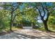 Lewisfield Plantation entrance framed by mature trees and featuring classic brick pillars leading to the property at 140 Old Plantation Ln, Moncks Corner, SC 29461