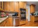 Modern kitchen featuring stainless steel appliances, granite countertops, and ample cabinet space at 140 Old Plantation Ln, Moncks Corner, SC 29461