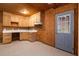 Small kitchenette features ample cabinet space, a white countertop and access to the outside at 140 Old Plantation Ln, Moncks Corner, SC 29461