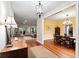 Inviting living area flows into dining space, showcasing hardwood floors, neutral tones, and ample natural light at 140 Old Plantation Ln, Moncks Corner, SC 29461