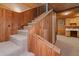 Carpeted staircase leading to the upper level of the home, showcasing the wood paneling at 140 Old Plantation Ln, Moncks Corner, SC 29461