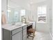 Elegant bathroom with double vanity, marble countertops, and a glass-enclosed shower at 1439 Clay Field Trl, Summerville, SC 29485