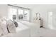 A bright bedroom has three large windows that let in plenty of natural light, creating a peaceful atmosphere at 1439 Clay Field Trl, Summerville, SC 29485