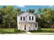 Charming two-story home with a welcoming front porch and beautifully landscaped front yard at 1439 Clay Field Trl, Summerville, SC 29485