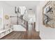 Elegant foyer with hardwood floors, staircase, and stylish decor leading into the home at 1439 Clay Field Trl, Summerville, SC 29485
