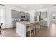 Modern kitchen with granite countertops, stainless steel appliances, and island seating at 1439 Clay Field Trl, Summerville, SC 29485