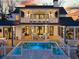 Luxurious backyard with a private pool, covered patio, and outdoor seating area at 151 Brailsford St, Charleston, SC 29492