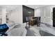 Modern bar area with a wooden counter, stylish stools, and a contemporary design at 151 Brailsford St, Charleston, SC 29492