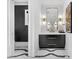 Modern powder room with stylish vanity, gold accents, and unique floor tile pattern at 151 Brailsford St, Charleston, SC 29492