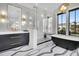 Modern bathroom boasts a soaking tub, frameless shower and sleek fixtures at 151 Brailsford St, Charleston, SC 29492