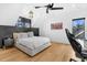 Bedroom with sloped ceiling, stylish fan, and a patriotic American flag art piece at 151 Brailsford St, Charleston, SC 29492