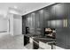 Luxury closet with custom black cabinetry, gold hardware, and display shelving at 151 Brailsford St, Charleston, SC 29492