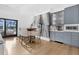 Dining area featuring a marble accent wall, wet bar, and seating for four at 151 Brailsford St, Charleston, SC 29492