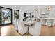 Dining area featuring a large table, plush chairs, and a view to the kitchen at 151 Brailsford St, Charleston, SC 29492