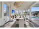Bright dining room with fireplace, television, and a view of the pool at 151 Brailsford St, Charleston, SC 29492