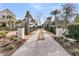 Long private driveway with palm trees and shrubbery at 151 Brailsford St, Charleston, SC 29492