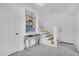 Bright entryway features a staircase with wood treads, modern railing, and decorative accent table at 151 Brailsford St, Charleston, SC 29492