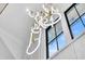 Bright foyer featuring a modern gold and white chandelier and a window with a view of the sky at 151 Brailsford St, Charleston, SC 29492