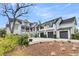 Lovely home exterior with a three-car garage and a beautiful garden at 151 Brailsford St, Charleston, SC 29492