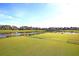 View of the lush green golf course with a pond at 151 Brailsford St, Charleston, SC 29492