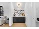 Hallway with custom marble countertop cabinets, modern lighting, and decor at 151 Brailsford St, Charleston, SC 29492