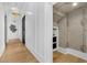 Hallway features contemporary lighting, millwork, and hardwood floors at 151 Brailsford St, Charleston, SC 29492