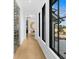Hallway leading to a wine cellar and other rooms with views to the exterior at 151 Brailsford St, Charleston, SC 29492