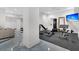 Well-equipped home gym with weight machines, a punching bag, and rubber flooring at 151 Brailsford St, Charleston, SC 29492