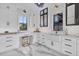 Bright kitchen features white cabinets, marble countertops, and modern finishes for a clean and modern aesthetic at 151 Brailsford St, Charleston, SC 29492